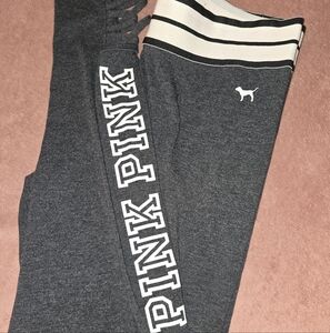 Pink leggings with criss cross detail on the ankles